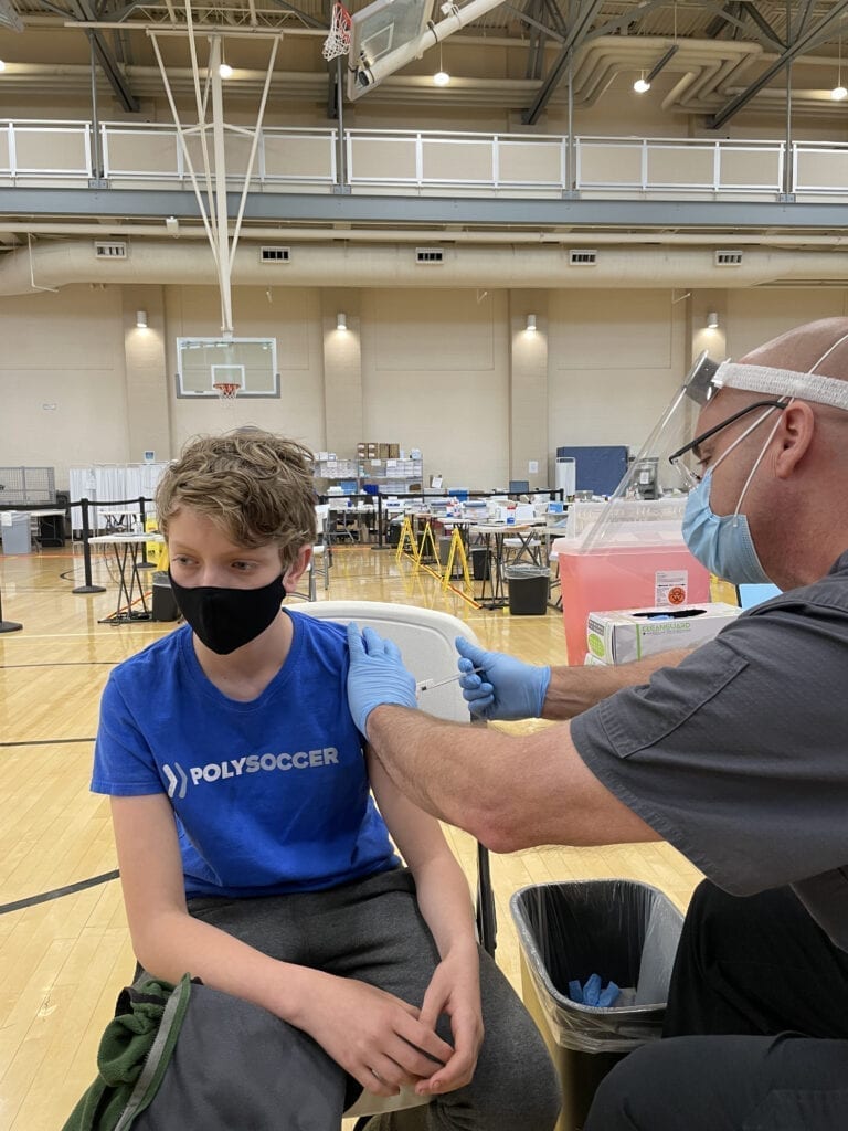13 year old boy getting vaccinated