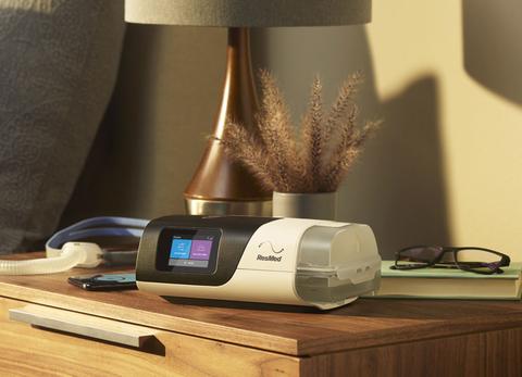 Resmed Airsense 11 on nightstand with Airfit P10 mask