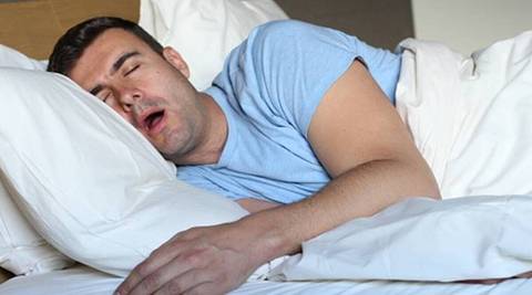 man snoring with mouth open