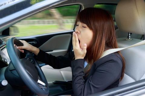 woman driving while tired