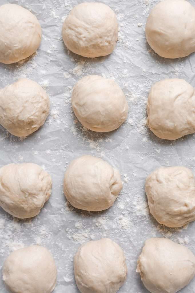 12 raw dough balls for making sourdough tortillas. 