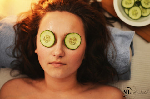 Close-up image of a woman with cucumber on her eyes - ML Delicate Beauty